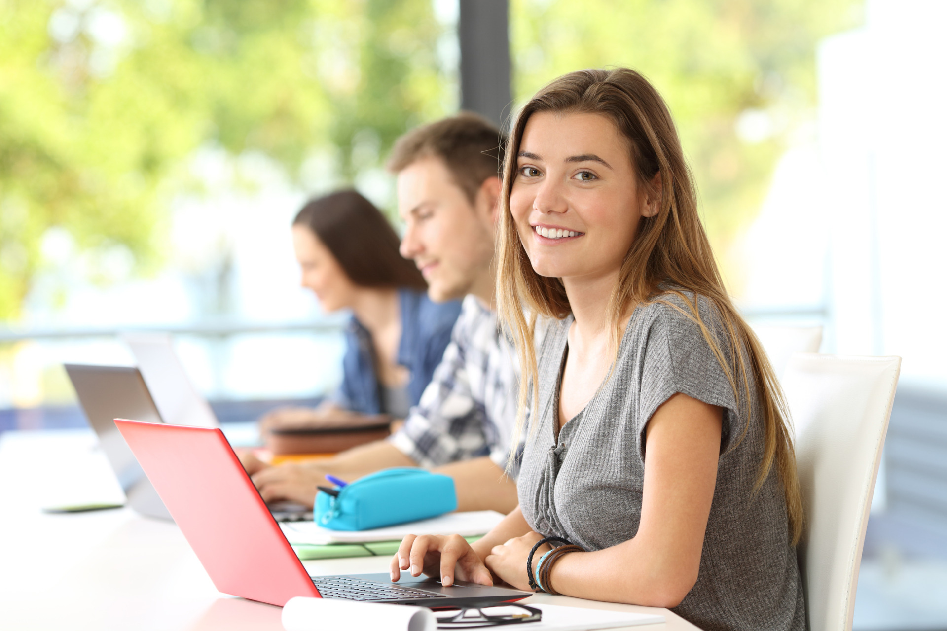 What is Digital Citizenship? Why is it so important? Happy student posing in a classroom